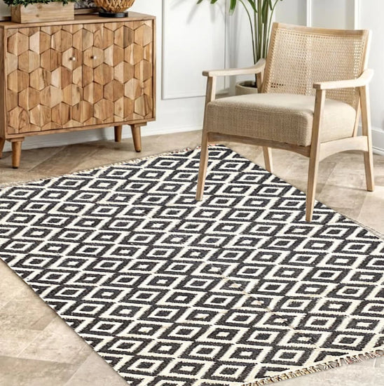 Black ikat printed cotton rug