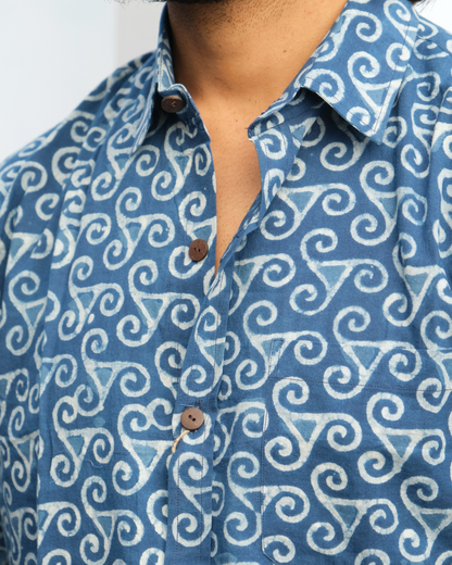 Blue shirt with white pattern worn by a person